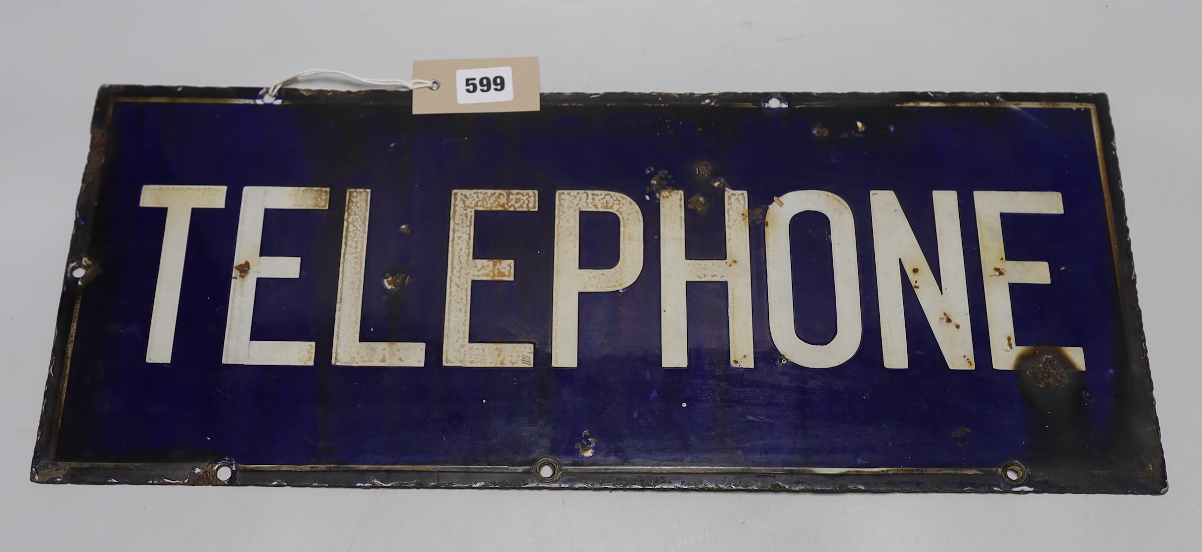 A rectangular enamel double sided ‘telephone’ sign, 56cm x 23cm